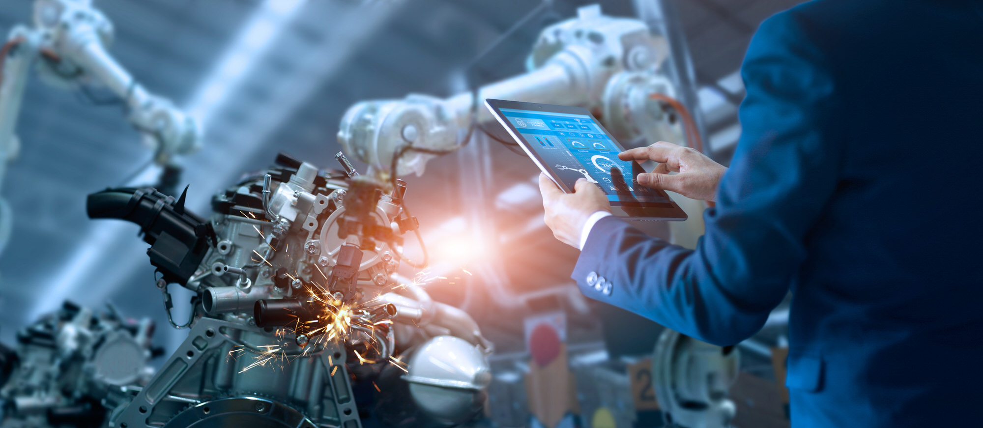 manager,engineer,check,and,control,automation,robot,arms,machine,in